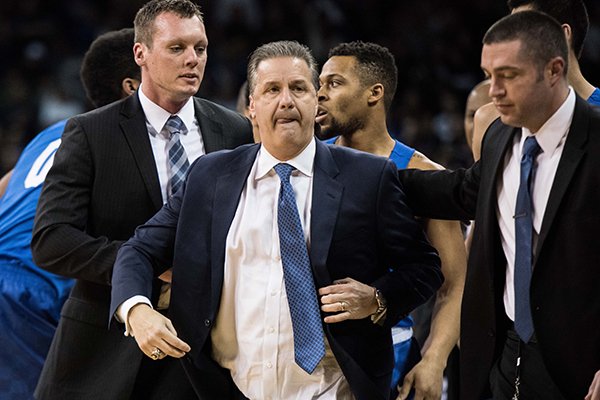 Kentucky head coach John Calipari leaves the court after receiving two technical fouls and getting ejected during the first half of an NCAA college basketball game against South Carolina Saturday, Feb. 13, 2016, in Columbia, S.C. Kentucky defeated South Carolina 89-62. (AP Photo/Sean Rayford)
