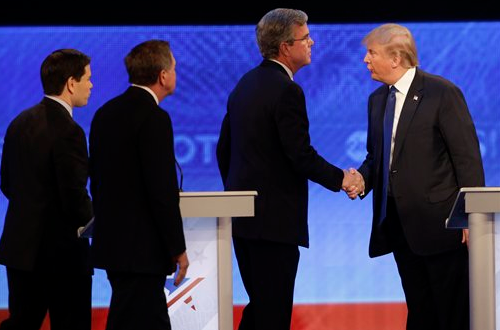 Republican presidential candidate Donald Trump shakes hands with fellow candidate, former Florida Gov. Jeb Bush, followed by Ohio Gov. John Kasich and, Sen. Marco Rubio, R-Fla. after a Republican presidential primary debate in Manchester, N.H. on Feb. 6, 2016. 