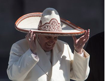 Pope Francis dons a Mexican charro style sombrero, in Mexico City's main sqaure, the Zocalo, on Saturday, Feb. 13, 2016. Pope Francis kicked off his first trip to Mexico with speeches to the country's political and ecclesial elites.