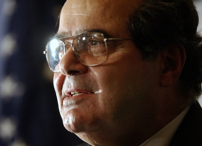 FILE - In this Saturday, Oct. 8, 2005, file photo, U.S. Supreme Court Justice Antonin Scalia speaks during a news conference in New York. The U.S. Marshals Service confirmed that Scalia died at the age of 79 on Saturday, Feb. 13, 2016. (AP Photo/Chad Rachman)