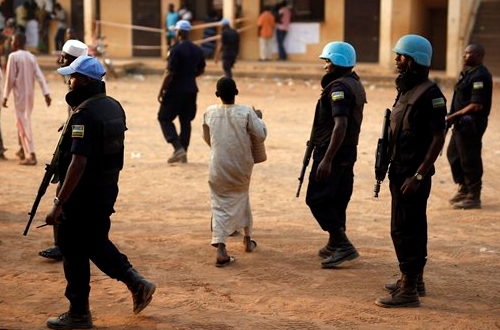 UN peacekeepers from Rwanda secure a polling station during vote counting in Bangui, Central African Republic, on Sunday Feb. 14, 2016. Two former prime ministers are running in the second round of presidential elections to end years of violence pitting Muslims against Christians.