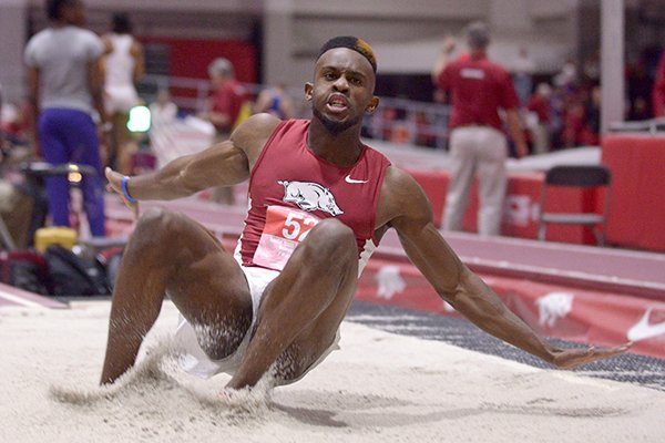 Jarrion Lawson of Arkansas competes in the invitational long jump on Friday Feb. 12, 2016, during the Tyson Invitational track meet at the Randal Tyson Track Center in Fayetteville.
