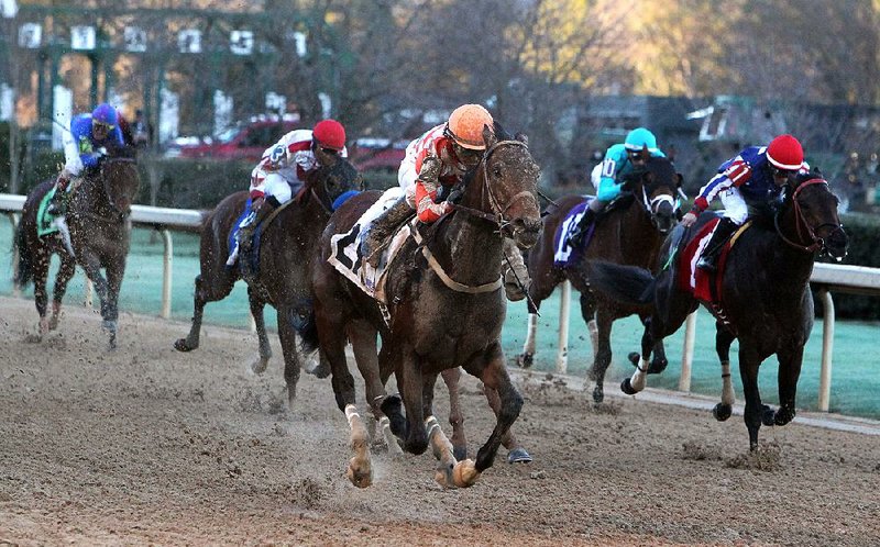 Jockey Luis Quinonez crosses the wire on Suddenbreakingnews (2X) to win the Southwest Stakes at Oaklawn Racing & Gaming Monday February 15, 2016. (The Sentinel-Record/Richard Rasmussen)