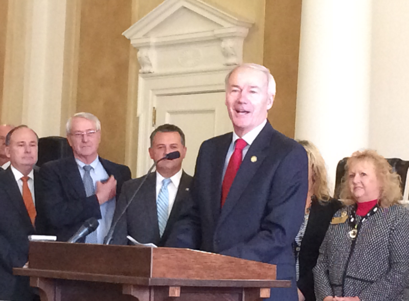 Gov. Asa Hutchinson tells more than 20 legislators and officials at a press conference Tuesday, Feb. 16, 2016, that supporting Arkansas Works is not the same as supporting the Affordable Care Act. 