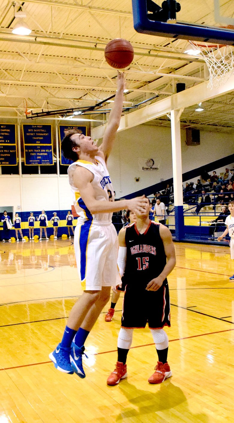 Photo by Mike Eckels Tyler Riddle (Decatur #24) slips past J.M. Gregg (Eureka Springs #15) for a layup during the Feb. 9 Decatur-Eureka Springs game at Peterson Gym in Decatur. This was the final regular season home game for Riddle as he made six points for the night.