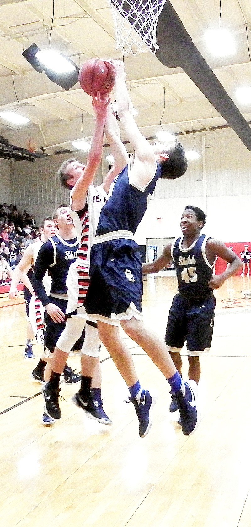 TIMES photograph by Annette Beard Blackhawk junior Joey Hall (No. 44) went up for a shot as Shiloh sophomore Gregory Bryant (No. 31) tried to block the goal Friday night, Feb. 12, in Blackhawk Gym.