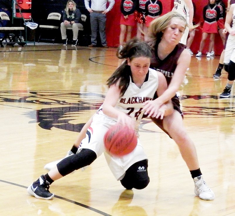 TIMES photograph by Annette Beard Lady Blackhawk Jennifer Anthony was heavily guarded by a Lady Eagle resulting in the two tripping and falling to the floor.