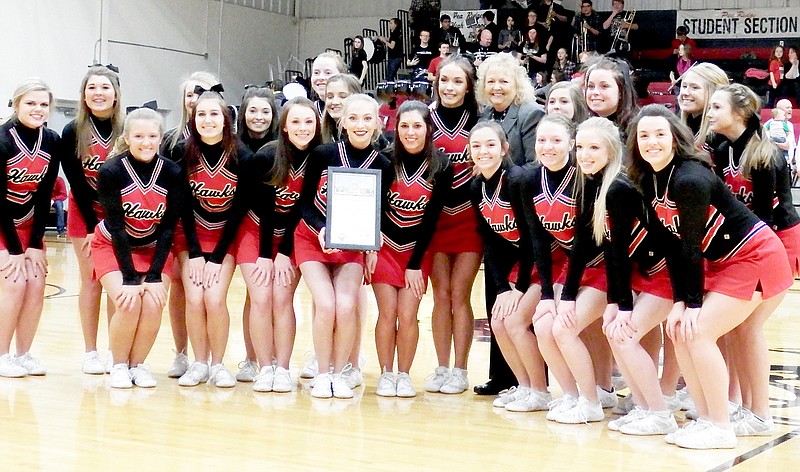 TIMES photograph by Annette Beard State Rep. Sue Scott presented a proclamation Tuesday night to the Blackhawk cheerleaders in recognition of their winning first place in the all-girl division of the Arkansas state cheerleading competition. The cheerleaders performed the routine that garnered them the first-place award.