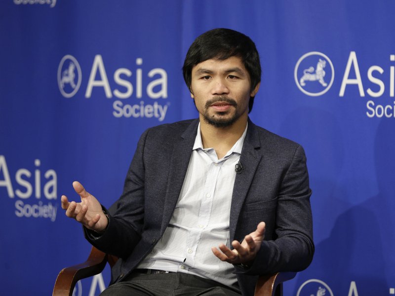 FILE - In this Oct. 12, 2015, file photo, Manny Pacquiao takes questions at the Asia Society in New York. Boxing star Pacquiao has created a firestorm in his home country after saying people in same-sex relationships are worse than animals. Pacquiao, who is running for a Philippine Senate seat, made the remark in a video posted Monday, Feb. 15, 2016, on local TV5s election site. He also said animals are better than people in same-sex relationships because they recognize the difference between males and females. (AP Photo/Seth Wenig, File)