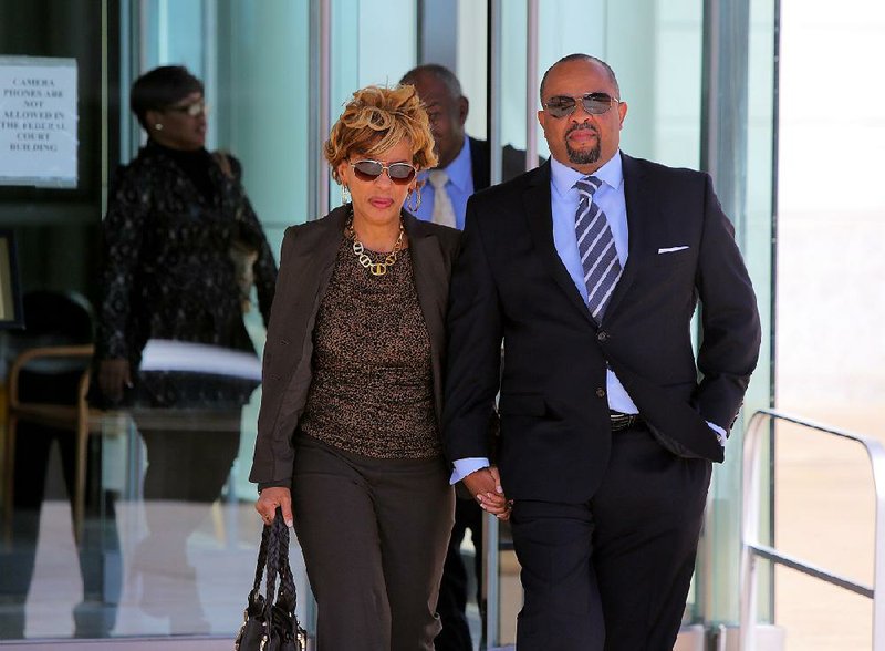 FILE — Steven Jones, former deputy director of the Arkansas Department of Human Services, leaves the federal courthouse in Little Rock with his wife, Susan, after his sentencing in 2016.