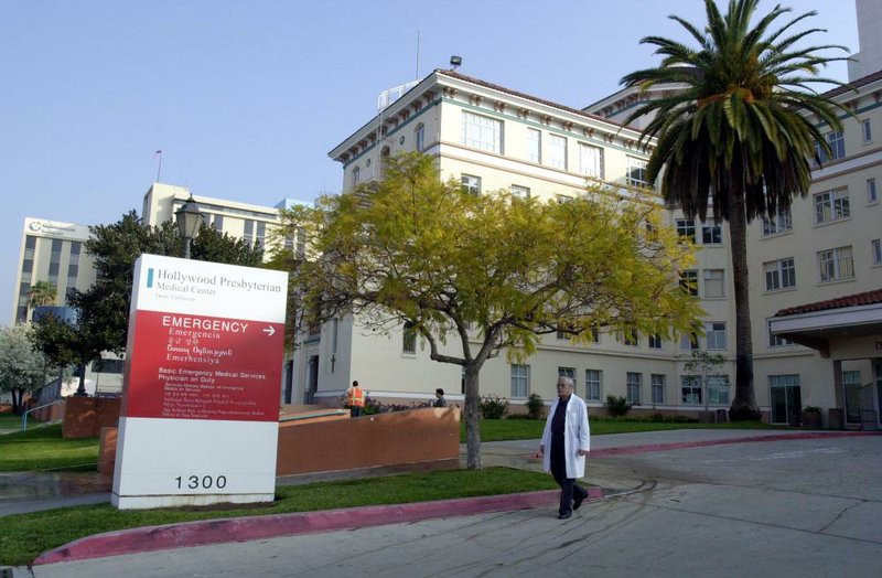 An employee leaves Hollywood Presbyterian Medical Center in Los Angeles in this fi le photo. The hospital recently paid a ransom of about $17,000 to hackers who infiltrated and disabled its computer network. 