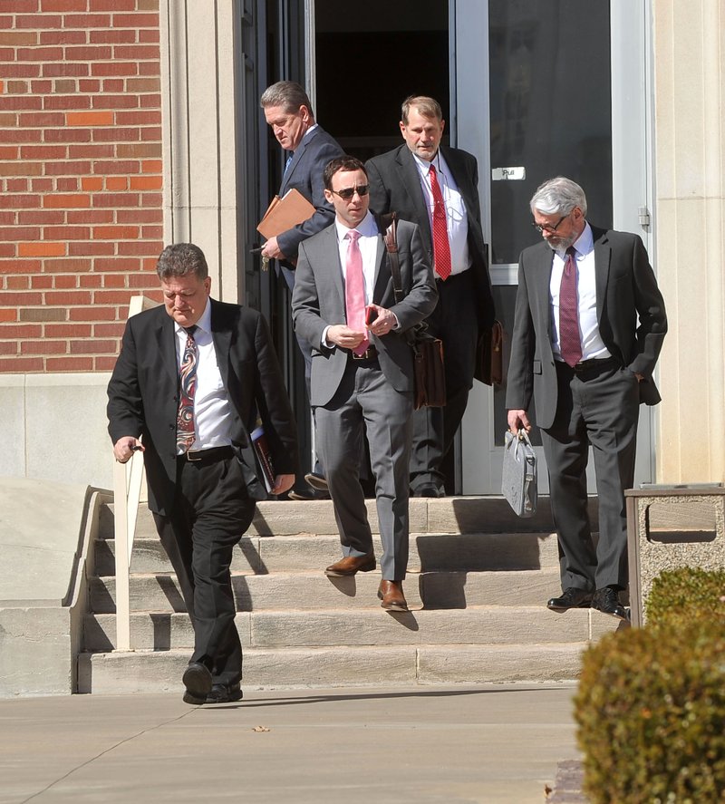 Attorneys leave the Judge Isaac C Parker Federal Building in Fort Smith on Thursday after appearing before U.S. District Judge P.K. Holmes to show why he shouldn’t sanction them for forum-shopping a multimillion-dollar class-action case.