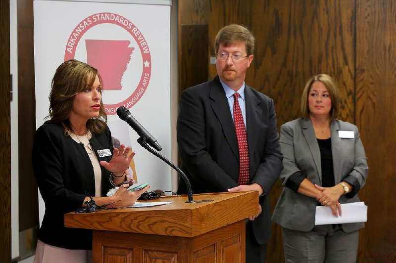 Stacy Smith (right), the Arkansas Department of Education's assistant commissioner for learning services, is shown with  Debbie Jones, left, and  Johnny Key, center.