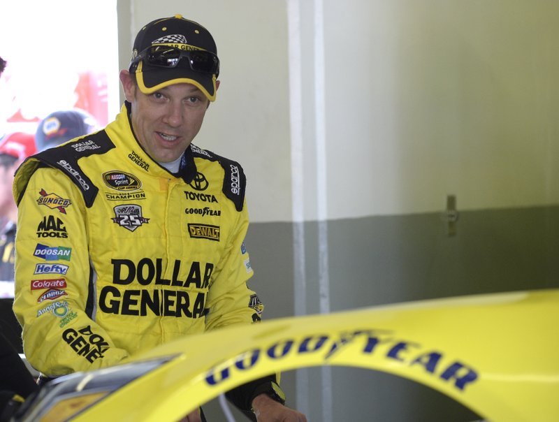 Matt Kenseth stands by his car during practice for Sunday's NASCAR Daytona 500 Sprint Cup series auto race at Daytona International Speedway in Daytona Beach, Fla., Friday, Feb. 19, 2016. 