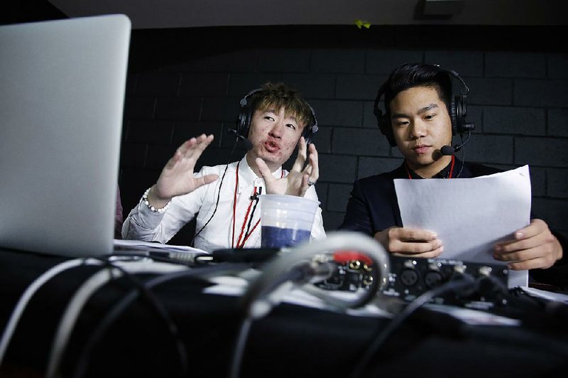 Temple students Javi Yuan (left) and James Yuan are broadcasting Temple’s games in Mandarin in a live audio stream over the internet. The two students say the broadcasts help bridge the cultural gap with their American peers.