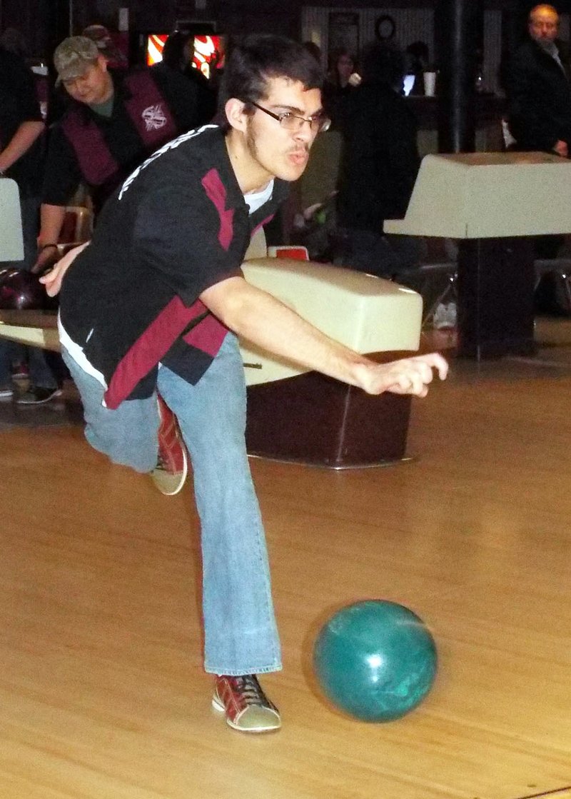 Photo by Randy Moll Spencer McCollum sends his ball down the alley on Feb. 4 in Gentry.