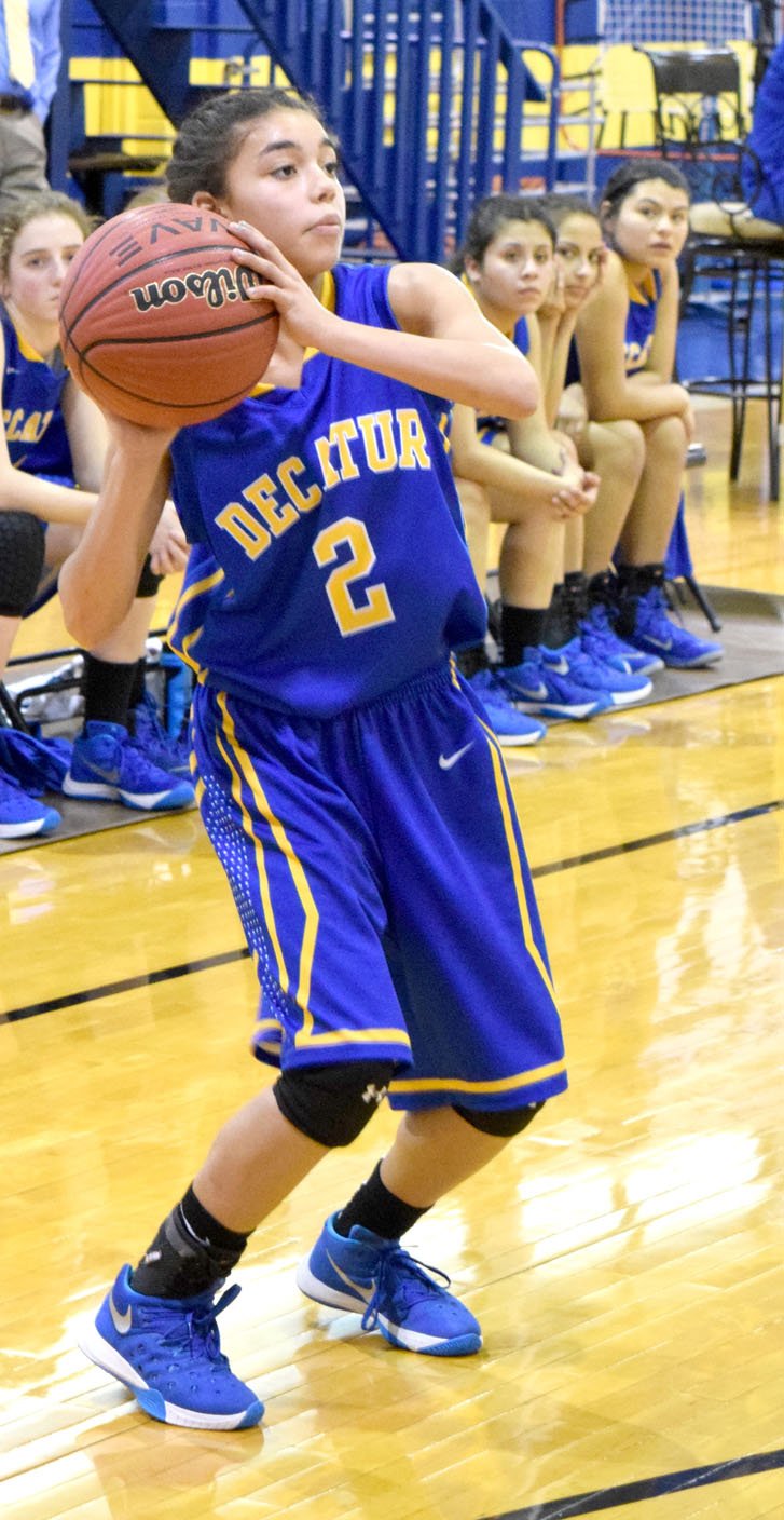 Photo by Mike Eckels Desi Meek (Decatur #2) looks to pass to a teammate across the court during the Decatur Bulldog-Union Christian Eagle game at Peterson Gym Feb. 17. Meek was one of three Decatur freshmen allowed to play during the tournament.