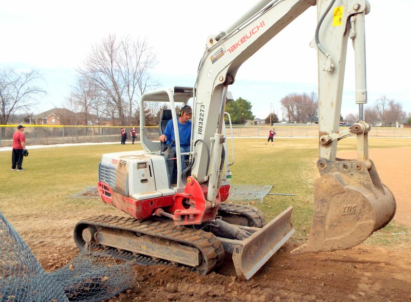 Photo by Randy Moll Softball practice was under way on Friday while work continued on improvements to the ballfields at Gentry High School. Improvements are being made to the dugouts and to the spectator areas.