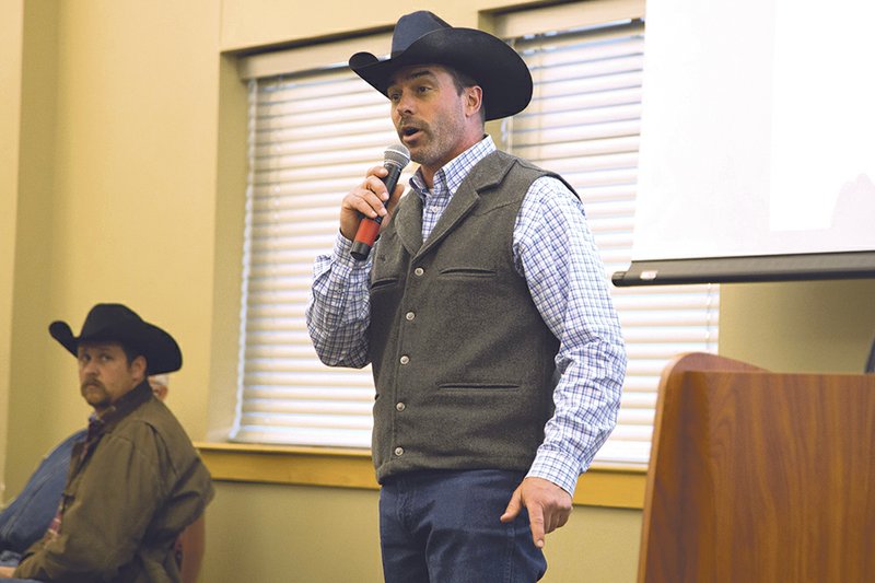 Chuck Wisdom, associate professor of agriculture at Arkansas State University-Beebe and event organizer for AG Day, greets FFA advisers at the 
AG Day 60th anniversary celebration.