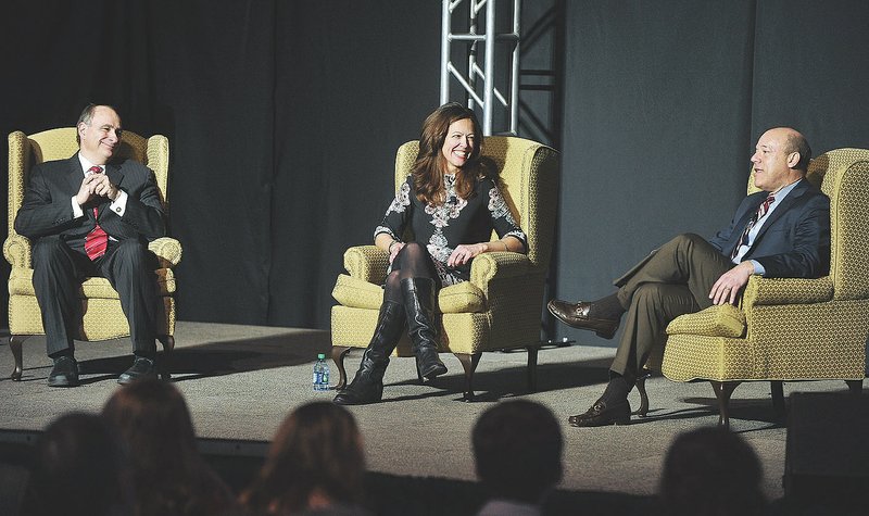 Moderator Janine Parry talks Thursday with David Axelrod (left) and Ari Fleischer on the University of Arkansas campus at Fayetteville. Fleischer, a former White House press secretary, and Axelrod, a former presidential campaign strategist, spoke about the partisan rift in Washington.