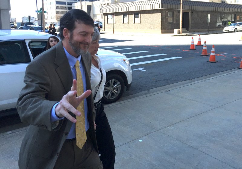 Ousted judge Michael Maggio walks into U.S. District Court in Little Rock in February.