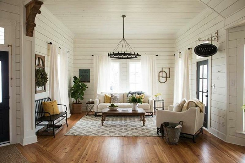 Chip and Joanna Gaines, co-hosts of HGTV’s Fixer Upper, used white walls to great effect in this living room.