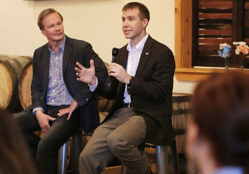 Gardening expert P. Allen Smith (left) and Wes Ward, Arkansas’ secretary of agriculture, talk with farmers about the challenges they face producing locally grown food at an event in Springdale.