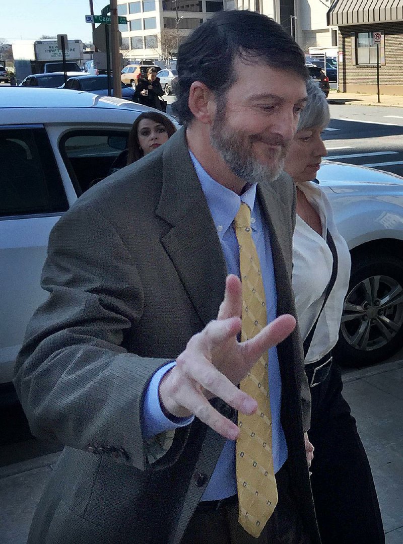 Former Circuit Judge Michael Maggio walks into U.S. District Court in Little Rock Friday, February 26, 2016.