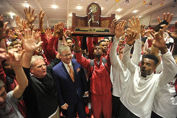 Arkansas' men's track team celebrates after winning the SEC Indoor Championship on Saturday, Feb. 27, 2016, at Randal Tyson Track Center in Fayetteville. 