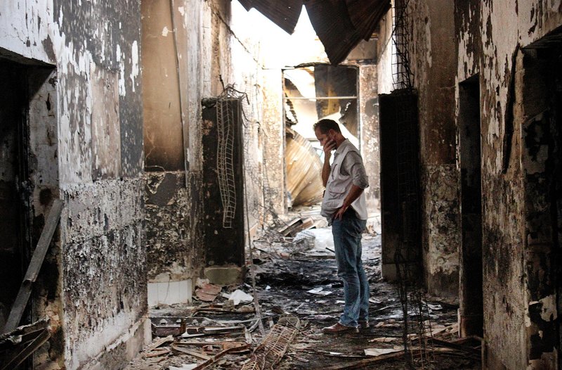 An employee of Doctors Without Borders walks inside the charred remains of the organization's hospital after it was hit by a U.S. airstrike in Kunduz, Afghanistan. 