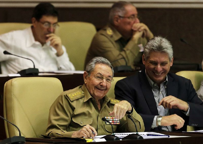 Cuban President Raul Castro (left) and heir-apparent Miguel Diaz-Canel attend a twice-annual legislative session at the National Assembly in Havana in December 2014. 