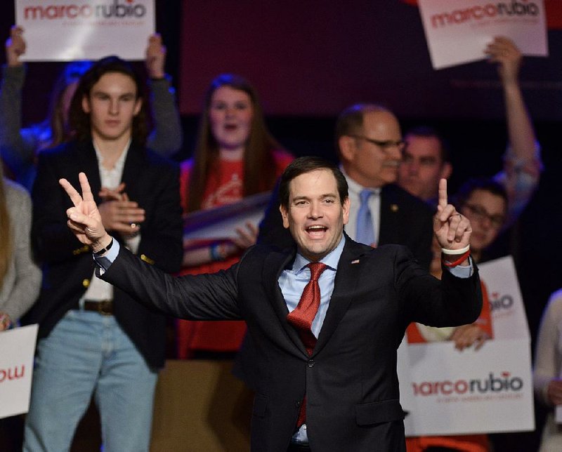 Marco Rubio takes the stage for a rally Saturday night at Immanuel Baptist Church in Rogers. On Saturday, Rubio and rival Ted Cruz released some of their income tax records.
