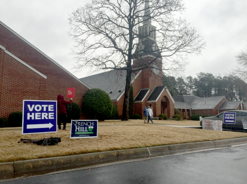 Voters head into the polls at Highland Valley United Methodist Church in West Little Rock Tuesday, during Arkansas' primary and judicial elections. 