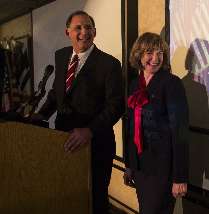 U.S. Sen. John Boozman, R-Ark., with wife Cathy by his side, speaks to the crowd gathered Tuesday night at the Embassy Suites in Little Rock after winning the Republican primary for the Senate.