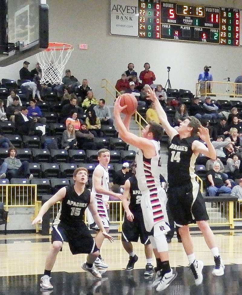 TIMES photograph by Annette Beard Blackhawk junior Westin Church went in for a shot Thursday night at the North Regional game against Pottsville.