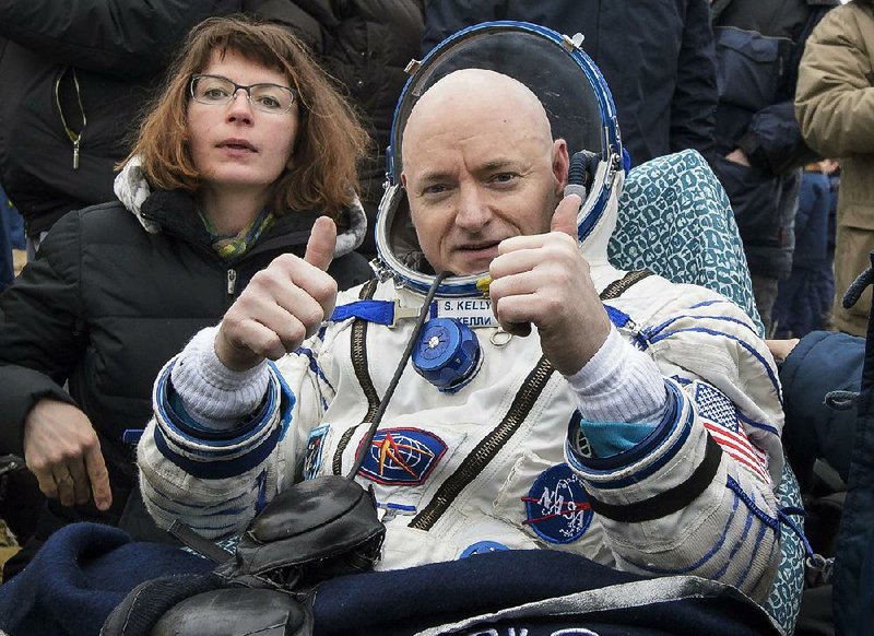 American astronaut Scott Kelly, giving a thumbs up after landing Wednesday in Kazakhstan, said the International Space Station is “a magnificent place and I’m going to miss it.” 