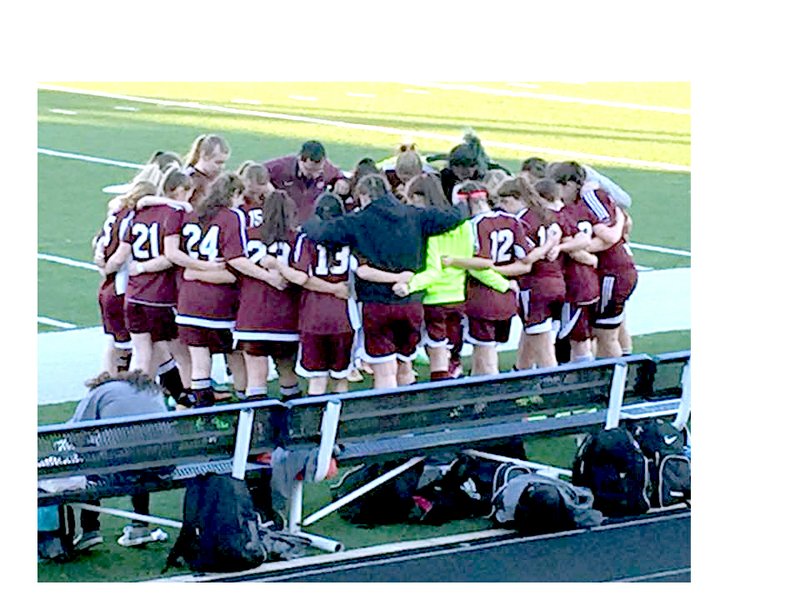 The Gentry High School girls' soccer team met in a huddle before taking to the field on February 29.