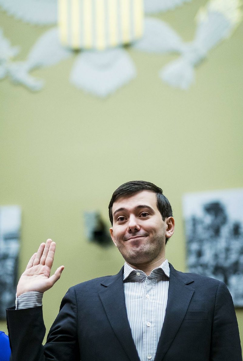 Martin Shkreli, former CEO of Turing Pharmaceuticals LLC, is sworn in during a House committee hearing in Washington last month. The strategy that Shkreli’s company used to raise the price on an old drug is used by many other drugmakers. 