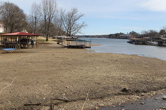 The Sentinel-Record/Richard Rasmussen REFILL SCHEDULED: An exposed lakebed near Lakeland Drive on Lake Hamilton will soon be covered by water as Entergy Arkansas Inc. starts raising lakes Hamilton and Catherine on Saturday. The refill will end March 13.