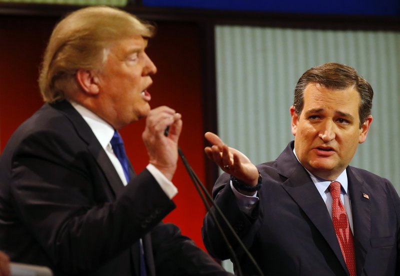 Republican presidential candidates businessman Donald Trump and Sen. Ted Cruz, R-Texas, argue a point Thursday during a Republican presidential primary debate at Fox Theatre in Detroit. 