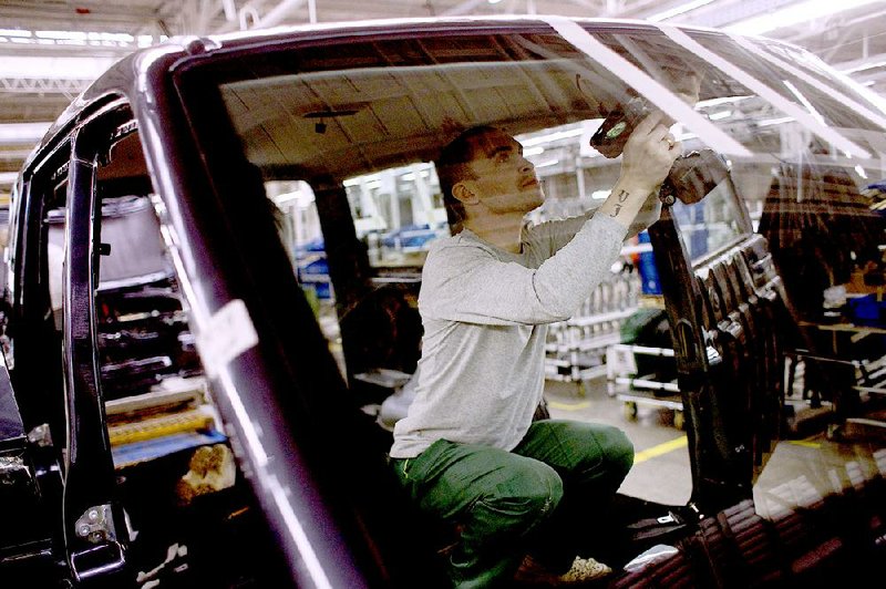 A worker assembles the interior of car at the UAZ car plant in the city of Ulyanovsk on the Volga River, Russia, in February. 
