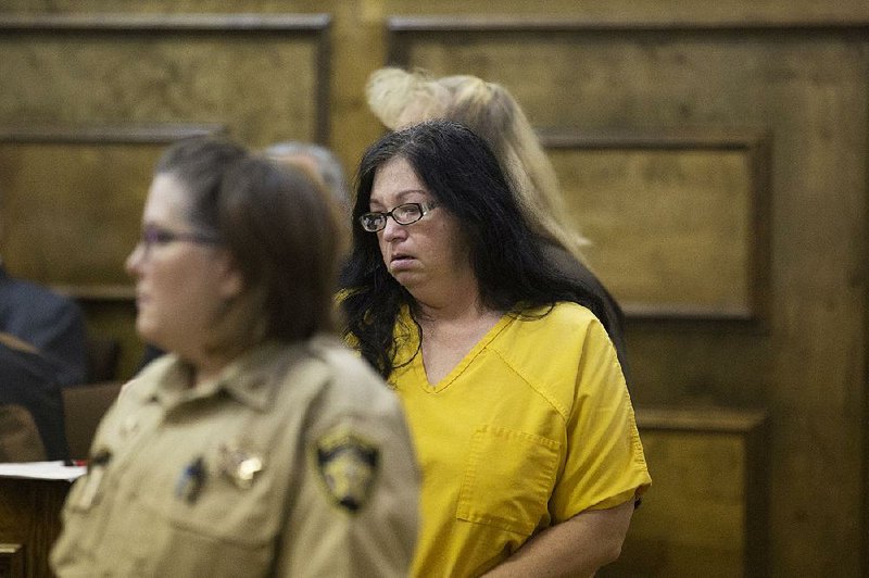 Traci Dierks, 41, of the Wallace community in Little River County is lead into the courtroom Tuesday morning January 26, 2016. Dierks is in custody for her involvement in the fatal shooting Caitlin Caskey 17 of Foreman at a party. 