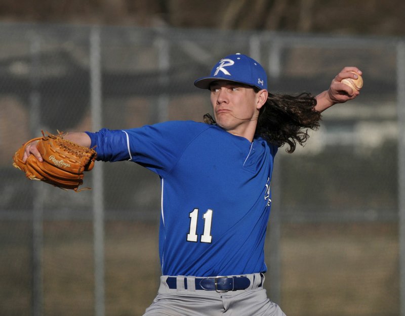 Harrison Heffley of Rogers High pitches Friday against Greenwood at Veterans Park in Rogers.