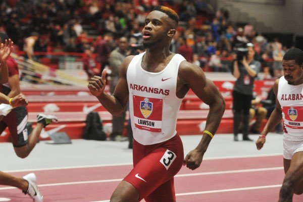 Arkansas sprinter Jarrion Lawson crosses the finish line of the men's 60-meter dash preliminaries Friday, Feb. 26, 2016, during the 2016 SEC Indoor Track and Field Championships at the Randal Tyson Track Center in Fayetteville.