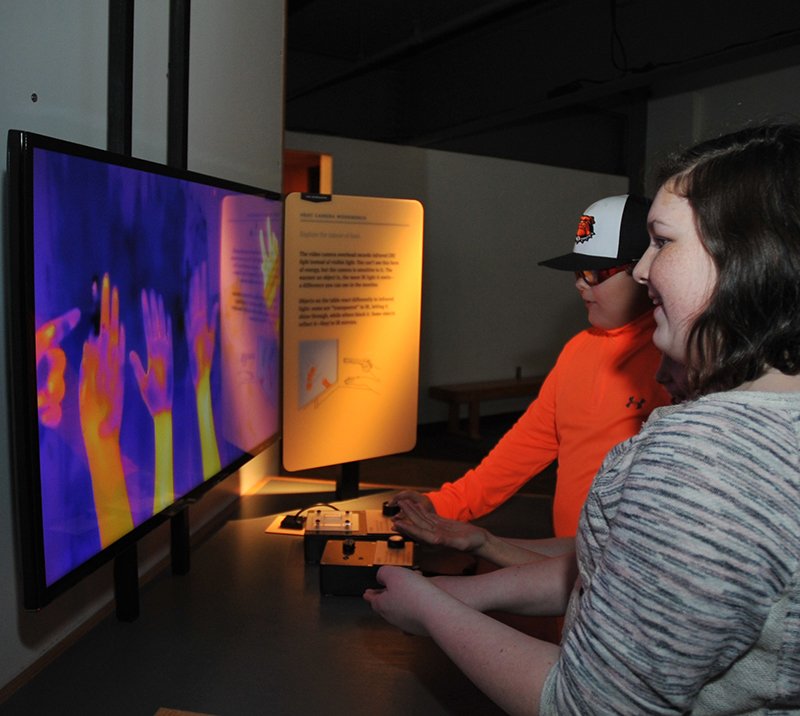 The Sentinel-Record/Mara Kuhn OKLAHOMA VISITORS: Macayla Baldwin, 12, a sixth-grader, right, and Connor Richard, 12, a seventh-grader, both of Valliant Middle School, in Valliant, Okla., explore Mid-America Science Museum with classmates on Friday.