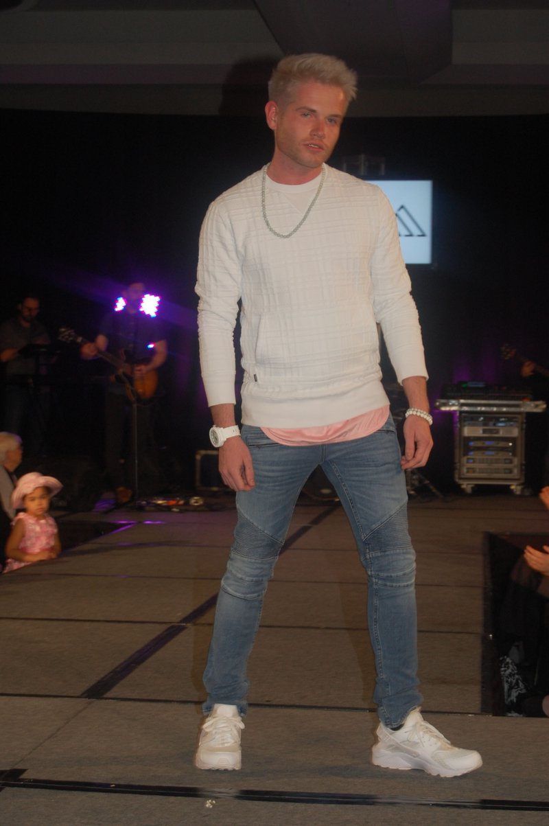 Blake Eiermann models an ensemble from Culture Clothing Co. at the ninth annual incarnation of The Fashion Event, a Feb. 26 fundraiser for Easter Seals Arkansas. Elongated undershirts with scoop tails and fish tails will be hot in spring menswear, says Culture Clothing store owner Cade Williams.