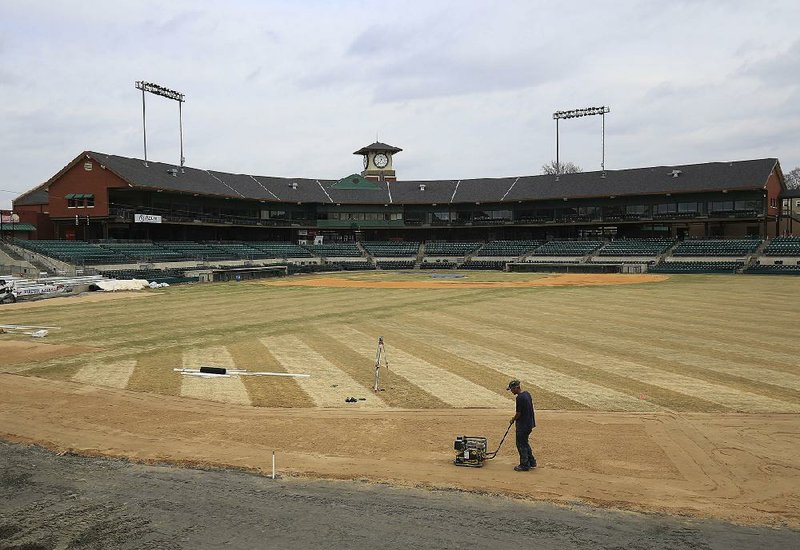 Arkansas Democrat-Gazette/STATON BREIDENTHAL --3/7/16-- A worker continues repairs from sink hole damage Monday in the outfield at Dickey-Stephens Park. Opening day for the Arkansas Travelers will be April 7th. 