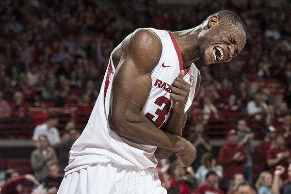 Arkansas forward Moses Kingsley (33) celebrates a dunk against Auburn in the second half Wednesday, Feb. 17, 2016, at Bud Walton Arena in Fayetteville. 