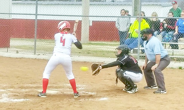 Photographs submitted Lady Blackhawk catcher Sara Whatley catches the pitch during the game Monday in Green Forest.