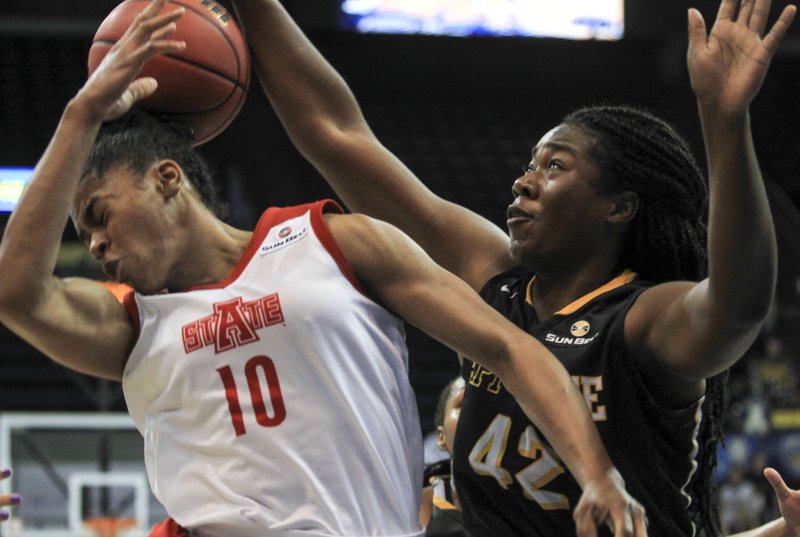 Arkansas State's Akasha Westbrook and Appalachian State's Mia Marshall battle for a rebound during ASU's first-round victory in the Sun Belt women's tournament in New Orleans on Wednesday, March 9, 2016.